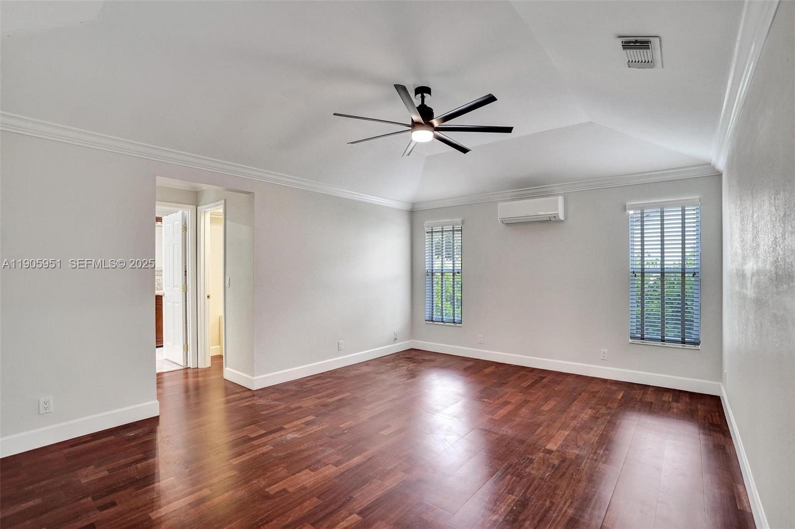 3801 Northwest 27th Avenue Boca Raton, FL 33434 - Photo 64 of 100 a view of an empty room with wooden floor and a window