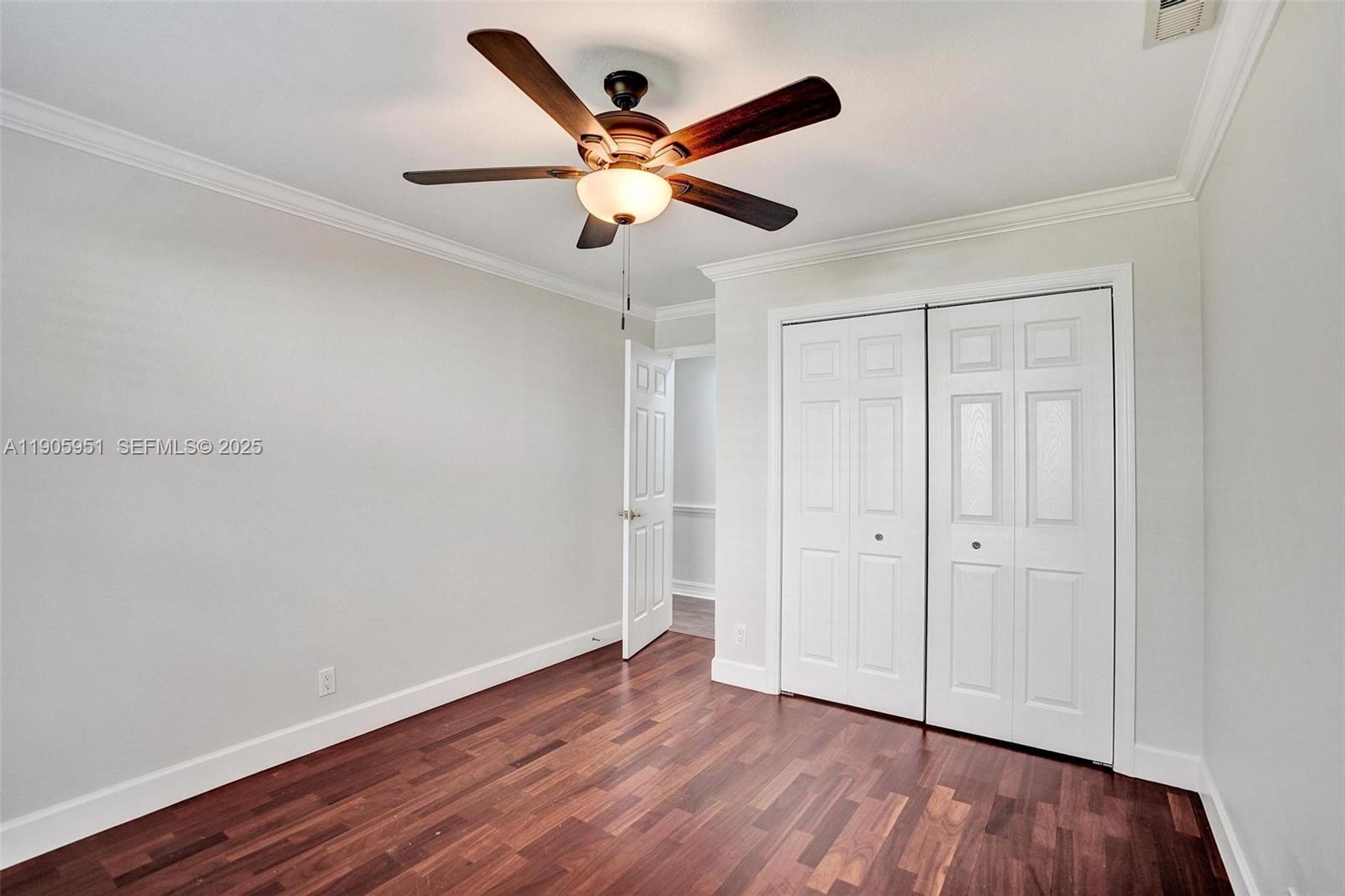 3801 Northwest 27th Avenue Boca Raton, FL 33434 - Photo 71 of 100 a view of an empty room with wooden floor