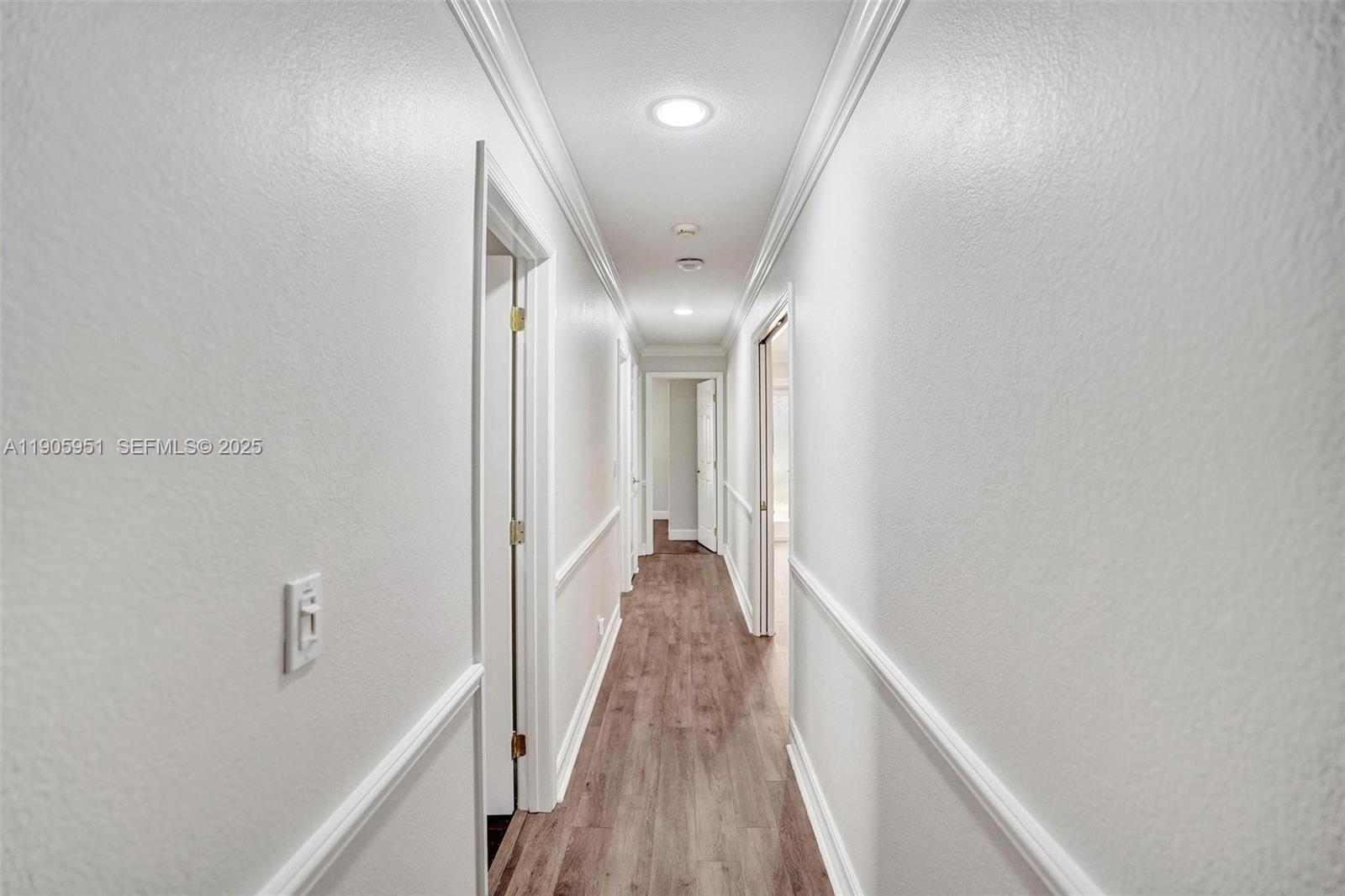 3801 Northwest 27th Avenue Boca Raton, FL 33434 - Photo 82 of 100 a view of a hallway with wooden floor and staircase