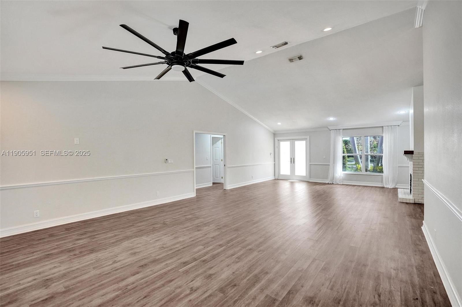 3801 Northwest 27th Avenue Boca Raton, FL 33434 - Photo 86 of 100 wooden floor in an empty room with a window