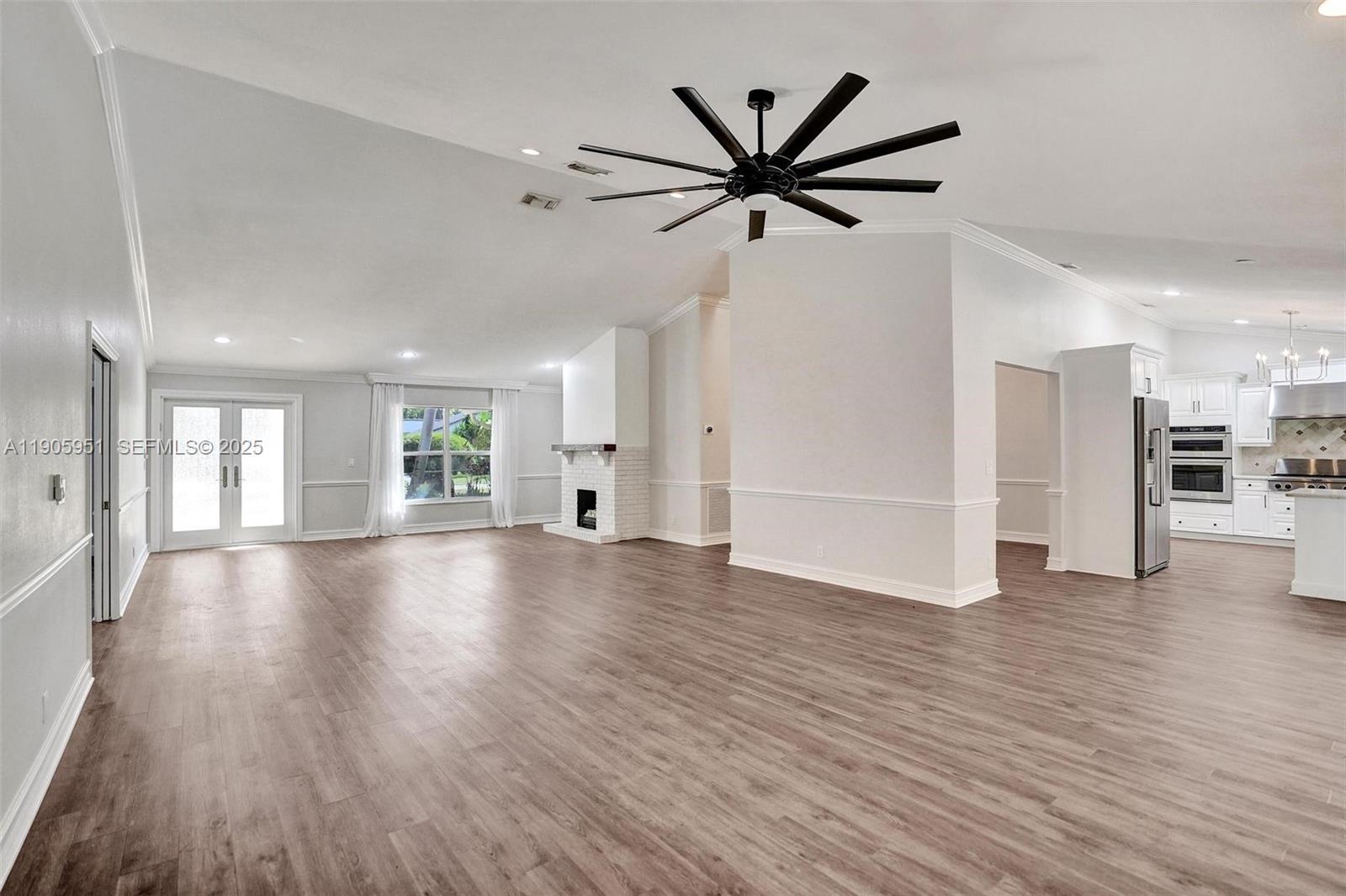 3801 Northwest 27th Avenue Boca Raton, FL 33434 - Photo 88 of 100 a view of empty room with wooden floor and window