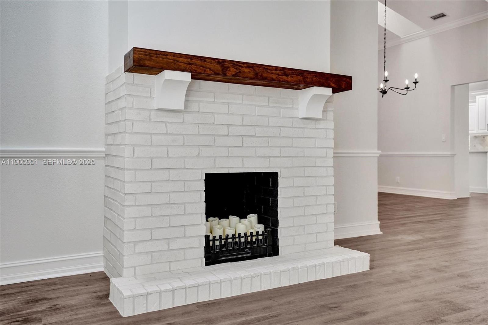 3801 Northwest 27th Avenue Boca Raton, FL 33434 - Photo 89 of 100 a view of a fireplace in wooden floor