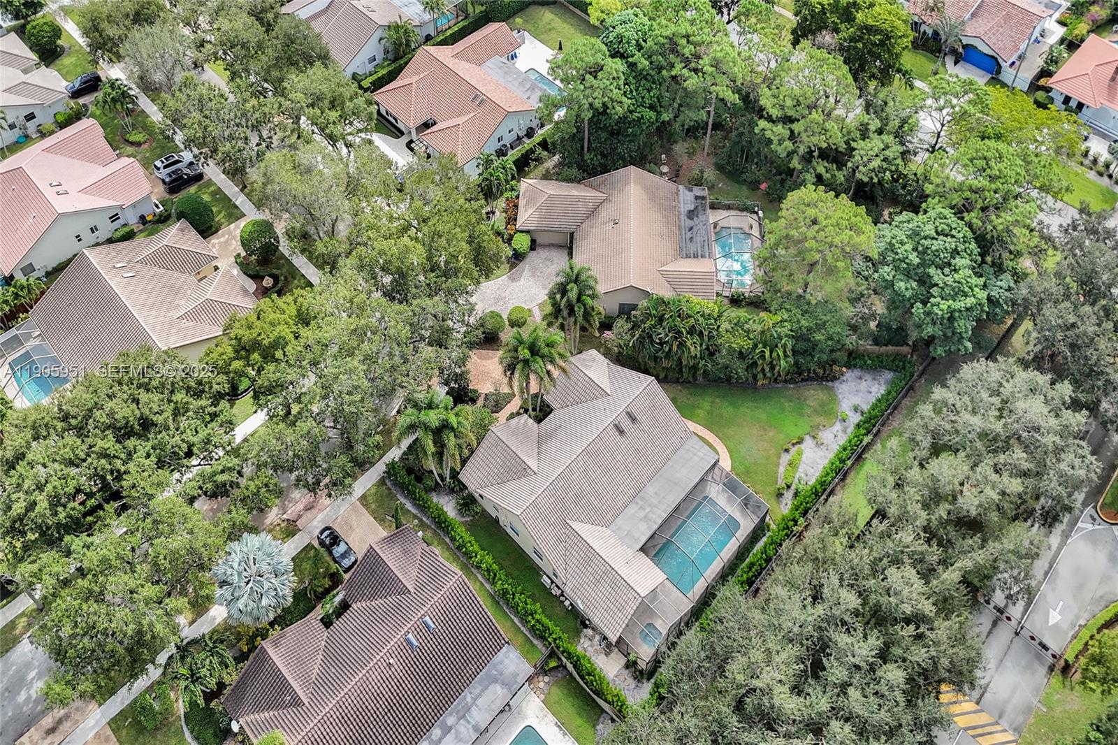 3801 Northwest 27th Avenue Boca Raton, FL 33434 - Photo 97 of 100 an aerial view of a house with a garden and lake view