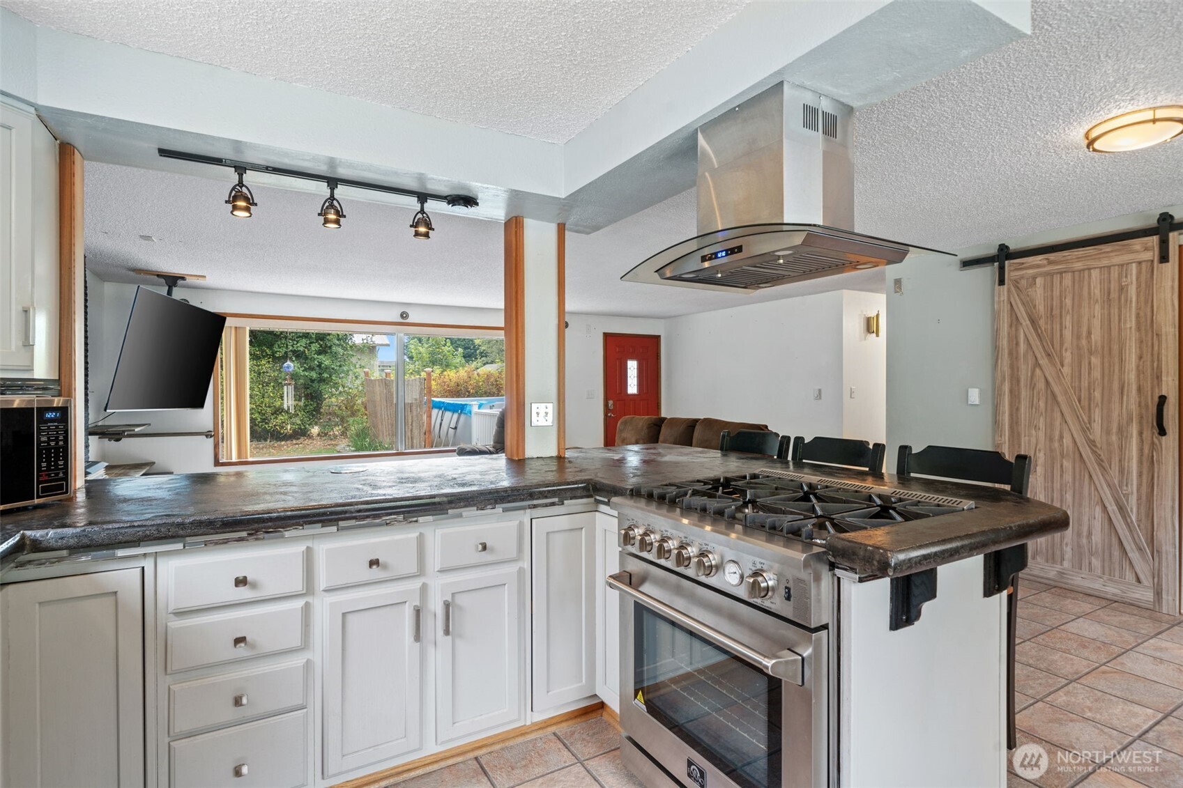 265 Cays Road Sequim, WA 98382 - Photo 15 of 40 a kitchen with granite countertop a sink appliances cabinets and a counter space
