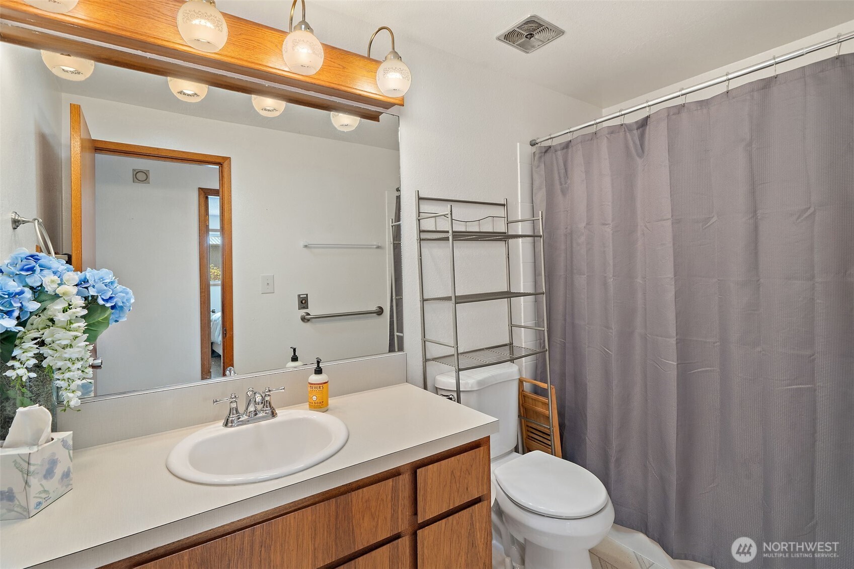 265 Cays Road Sequim, WA 98382 - Photo 18 of 40 a bathroom with a sink vanity mirror and toilet