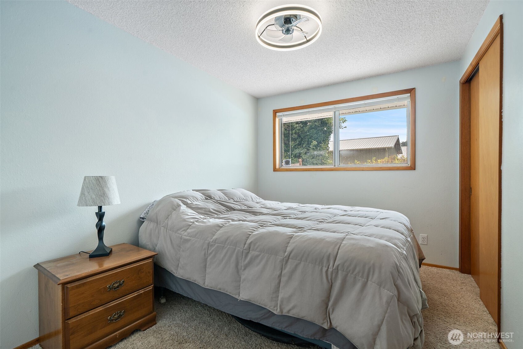 265 Cays Road Sequim, WA 98382 - Photo 19 of 40 a bedroom with a bed and a window