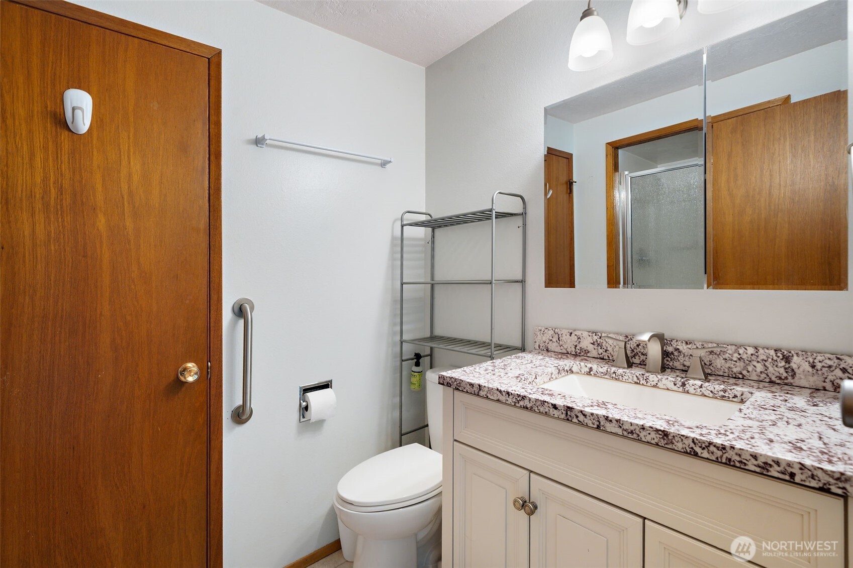 265 Cays Road Sequim, WA 98382 - Photo 25 of 40 a bathroom with a granite countertop sink toilet and shower