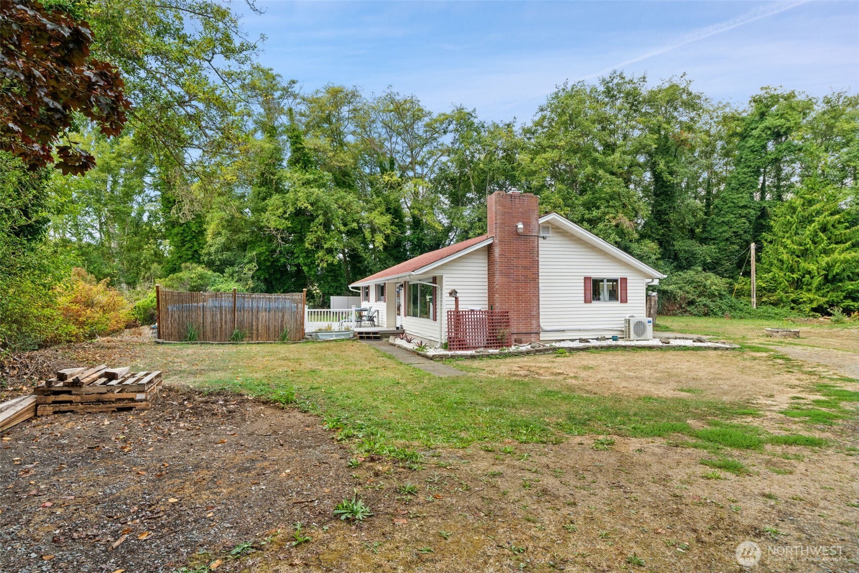 265 Cays Road Sequim, WA 98382 - Photo 28 of 40 a view of a yard in front of a house with large trees