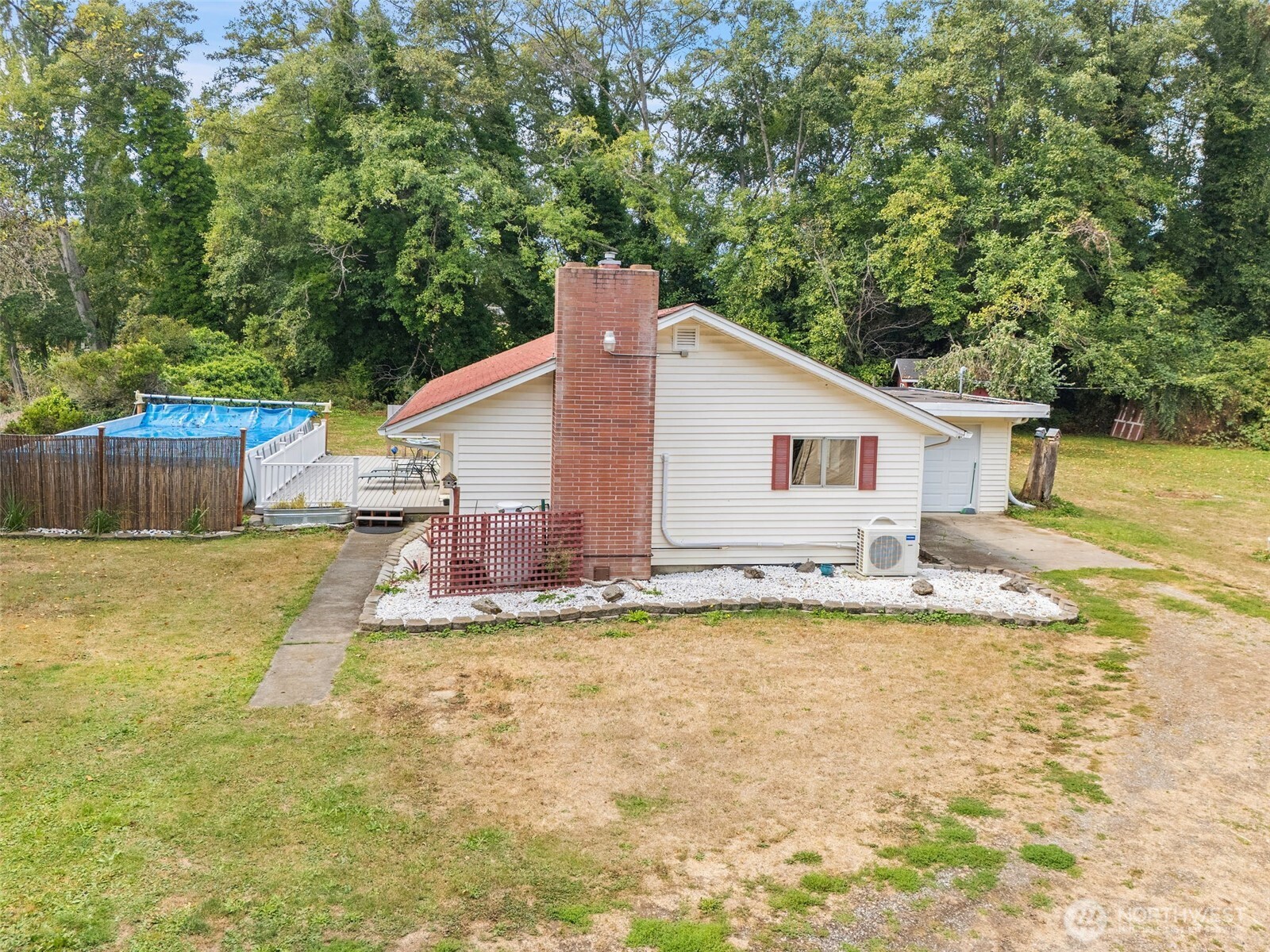 265 Cays Road Sequim, WA 98382 - Photo 35 of 40 a view of a house with a yard and a large tree