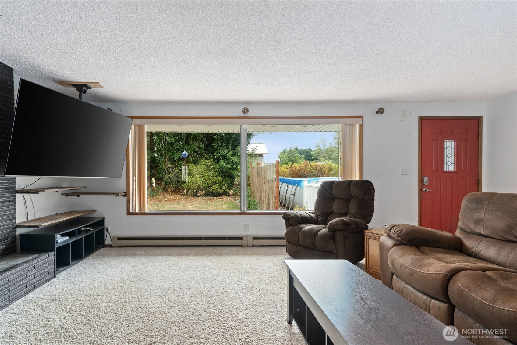 265 Cays Road Sequim, WA 98382 - Photo 5 of 40 a living room with furniture and a flat screen tv