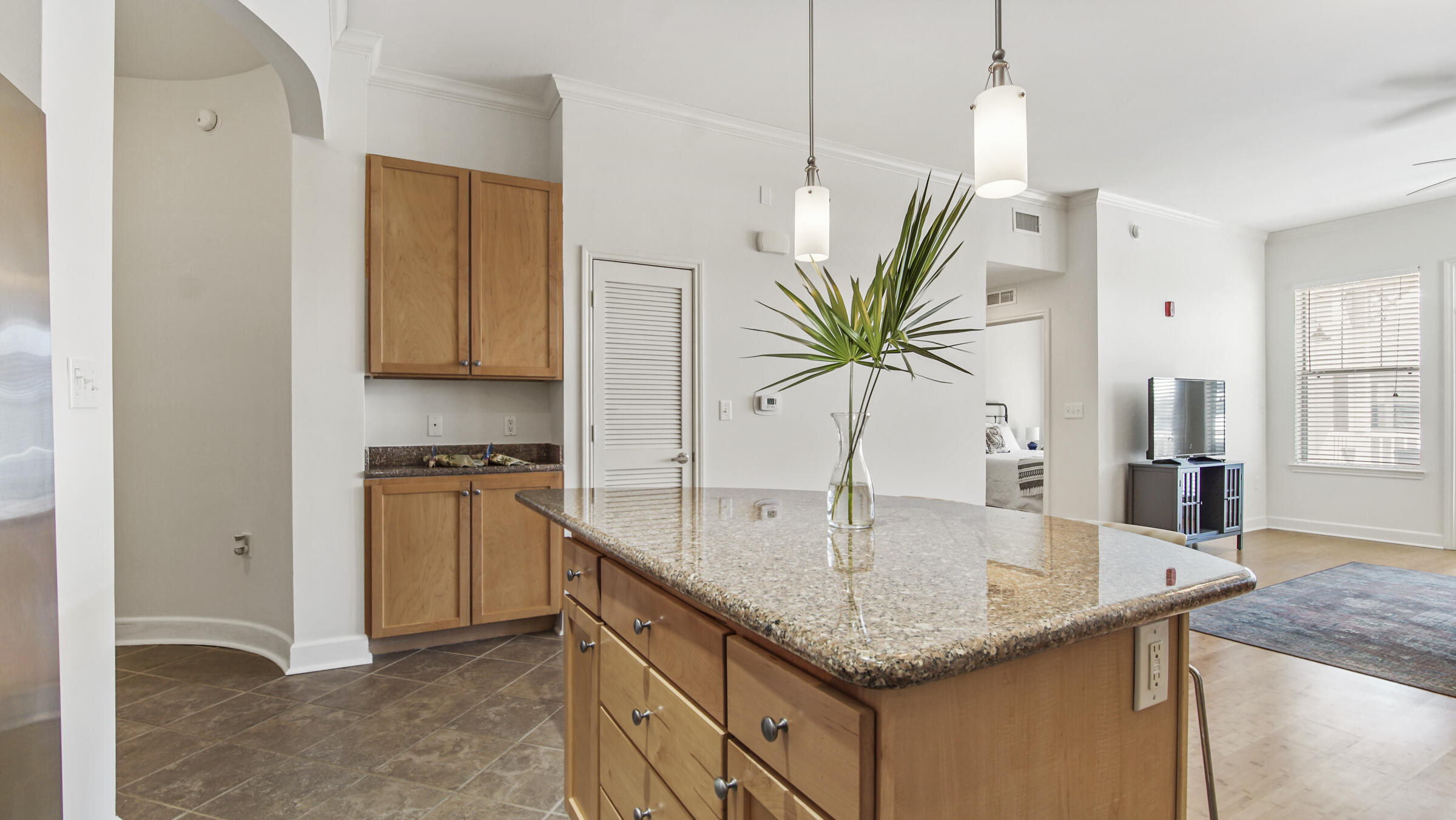 8700 Front Beach Road, Unit 5313 Panama City Beach, FL 32407 - Photo 12 of 38 a kitchen with stainless steel appliances granite countertop a sink a counter space and cabinets