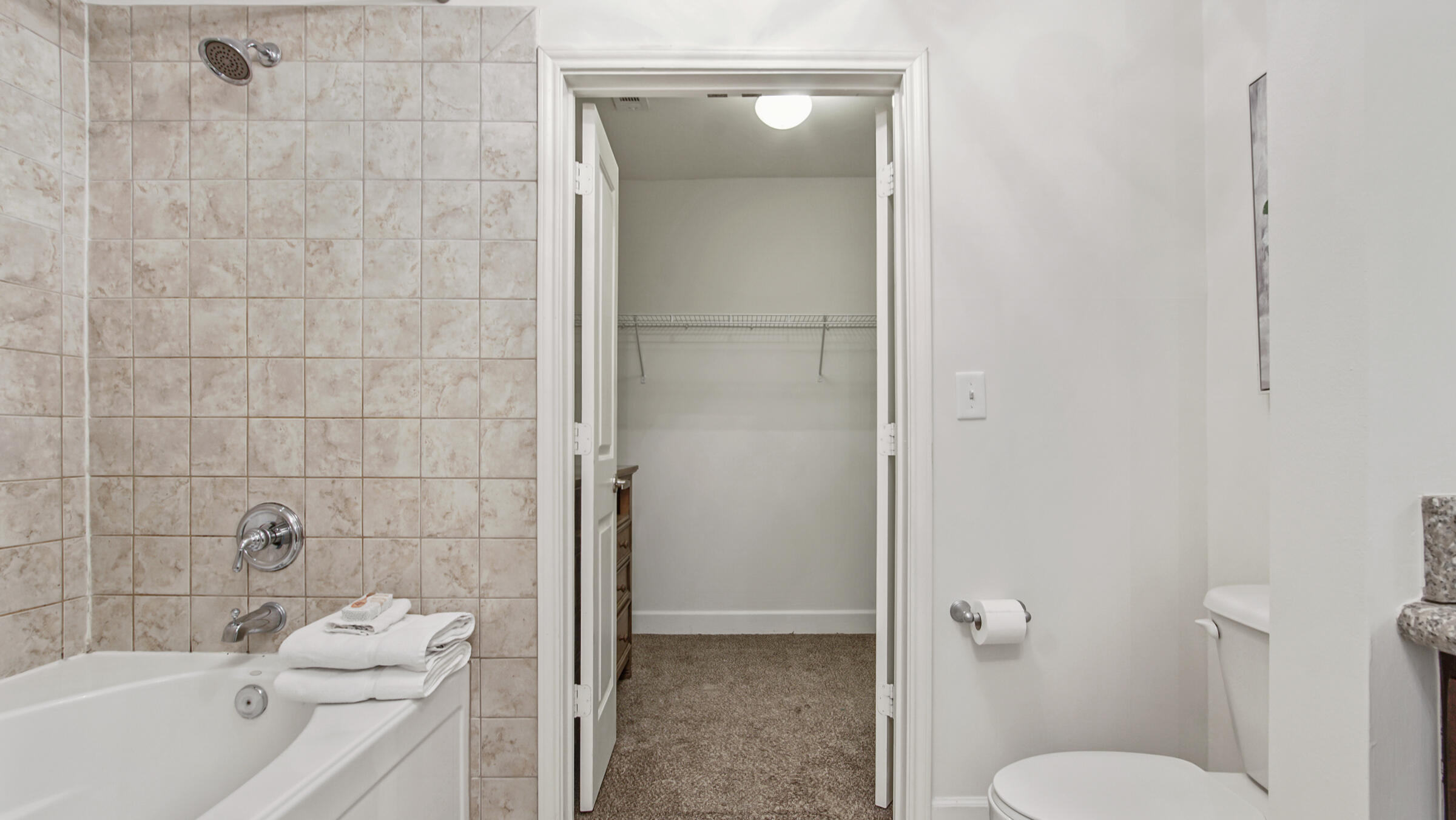 8700 Front Beach Road, Unit 5313 Panama City Beach, FL 32407 - Photo 19 of 38 a bathroom with a toilet a sink and shower