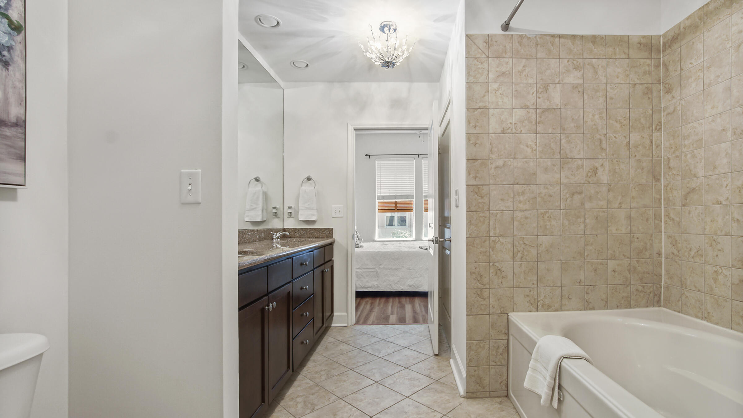 8700 Front Beach Road, Unit 5313 Panama City Beach, FL 32407 - Photo 20 of 38 a bathroom with a sink a washer and dryer