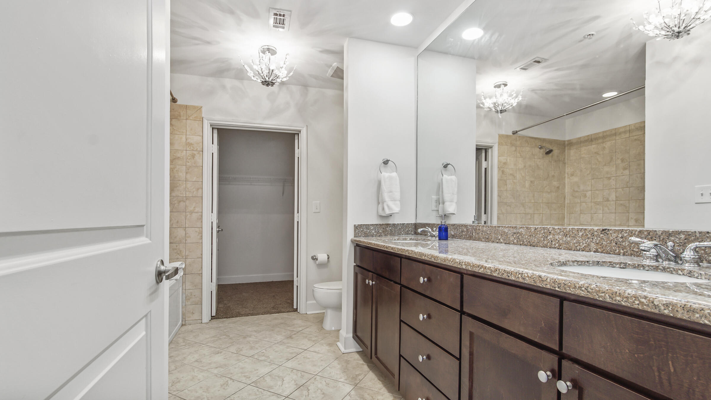 8700 Front Beach Road, Unit 5313 Panama City Beach, FL 32407 - Photo 22 of 38 a bathroom with a double vanity sink mirror and double