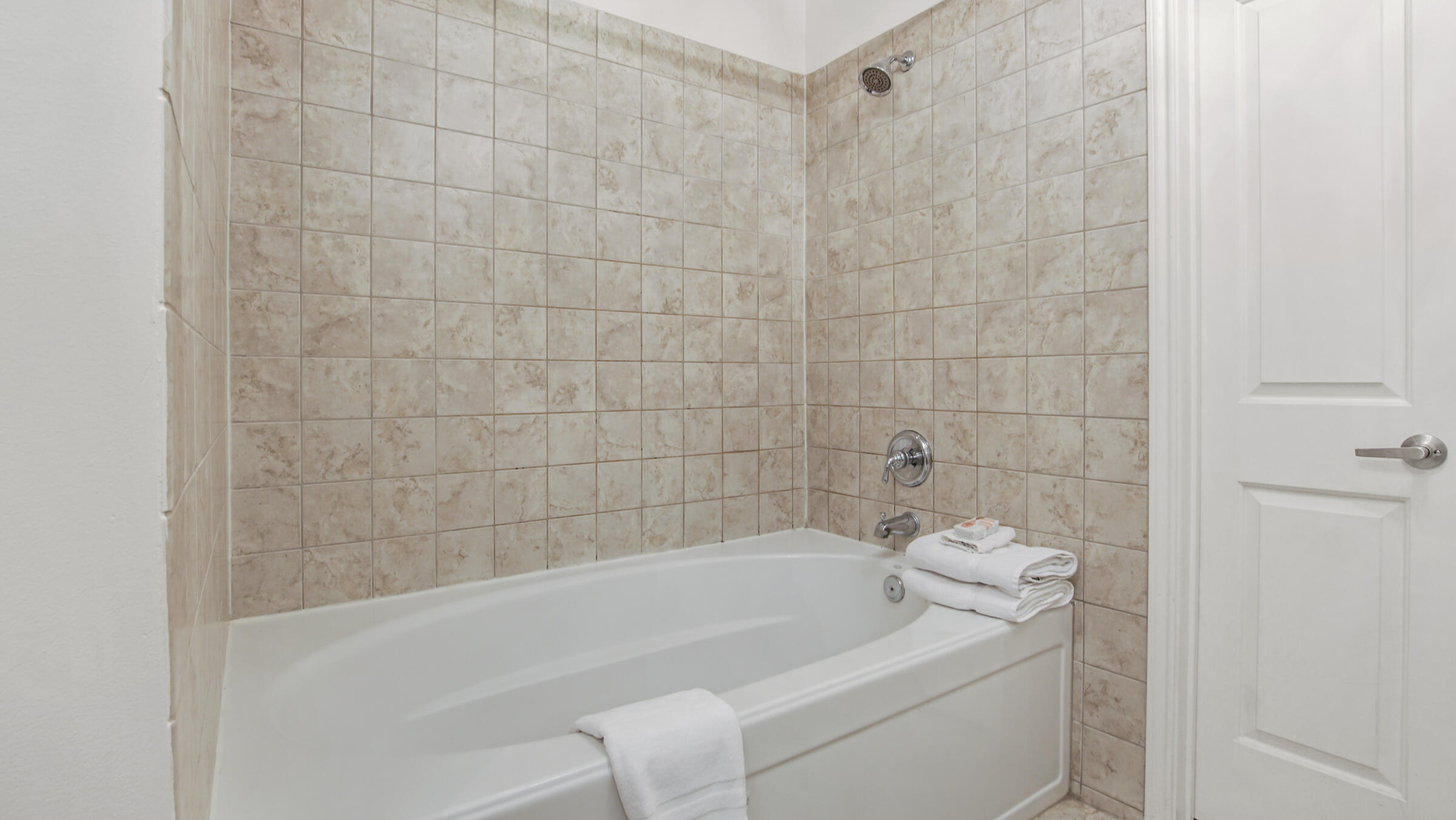 8700 Front Beach Road, Unit 5313 Panama City Beach, FL 32407 - Photo 23 of 38 a bathroom with a bathtub and shower