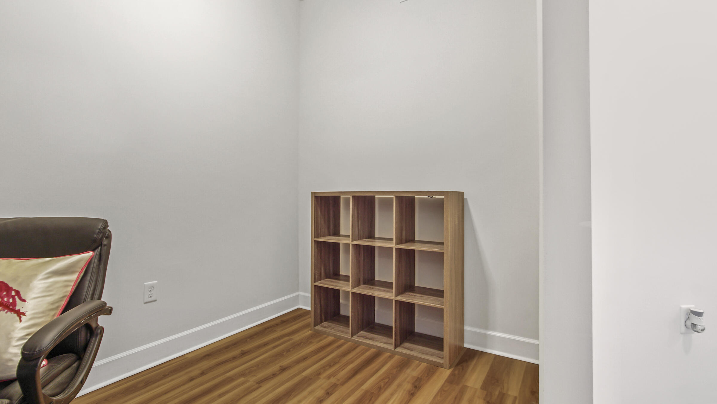 8700 Front Beach Road, Unit 5313 Panama City Beach, FL 32407 - Photo 26 of 38 a room with a wooden floor and shelf