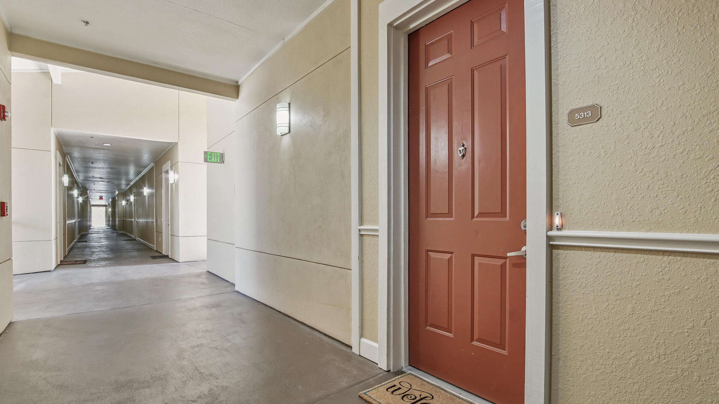 8700 Front Beach Road, Unit 5313 Panama City Beach, FL 32407 - Photo 28 of 38 a view of a hallway with wooden floor