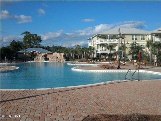 8700 Front Beach Road, Unit 5313 Panama City Beach, FL 32407 - Photo 32 of 38 a view of a swimming pool with a patio