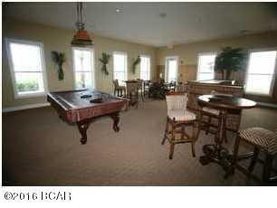 8700 Front Beach Road, Unit 5313 Panama City Beach, FL 32407 - Photo 37 of 38 a living room with furniture pool table and windows