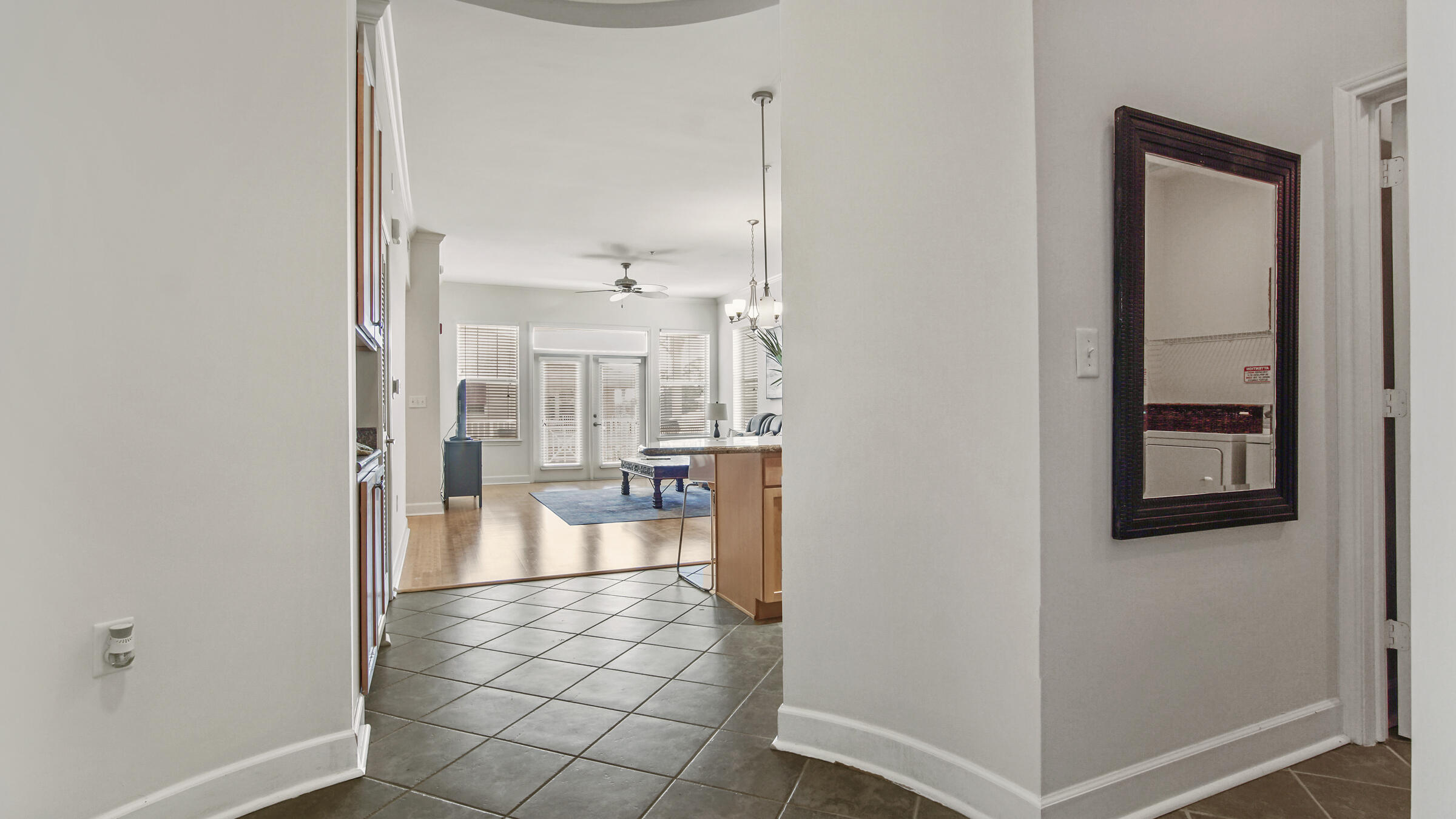 8700 Front Beach Road, Unit 5313 Panama City Beach, FL 32407 - Photo 5 of 38 a view of a hallway with bathroom and wooden floor