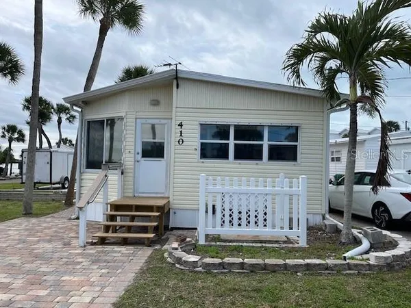 a front view of a house with garage