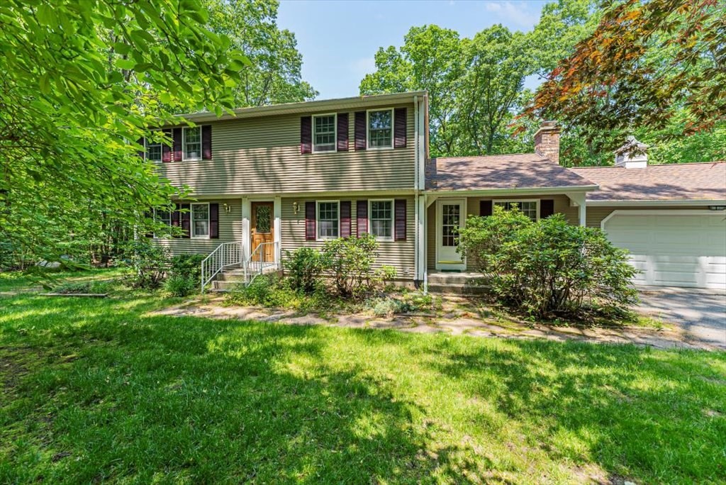 299 Bennett Road Hampden, MA 01036 - Photo 1 of 41 a front view of a house with a yard