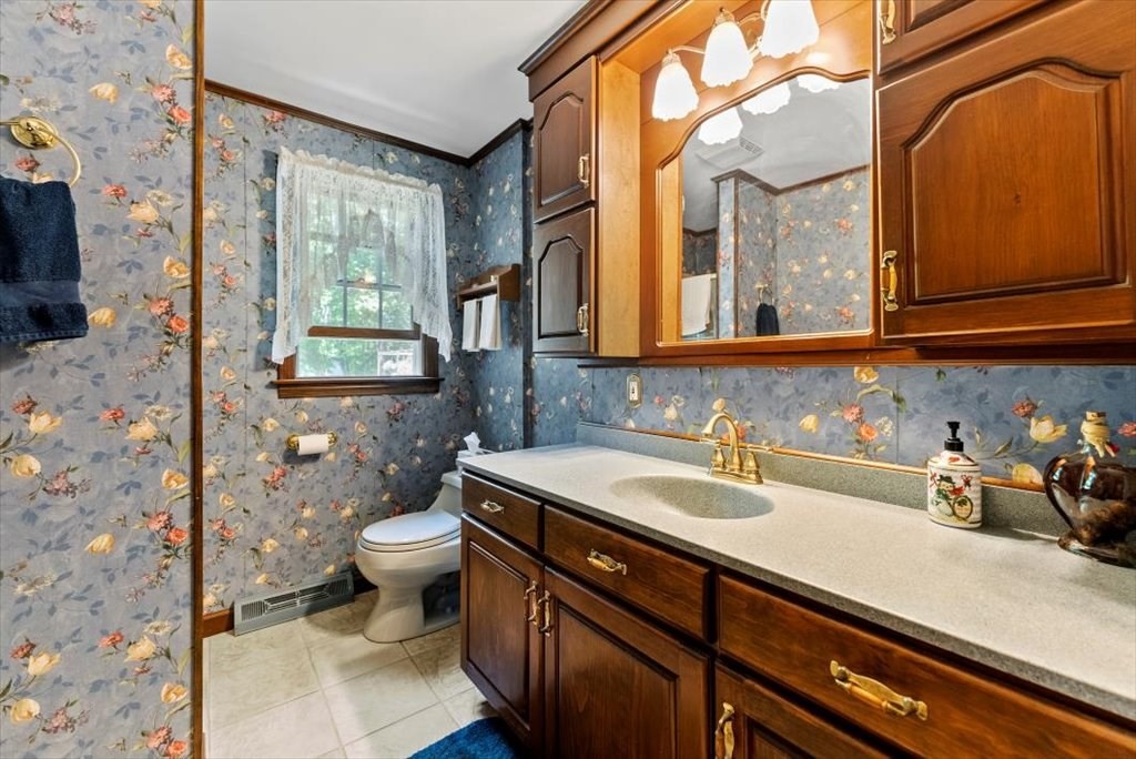 299 Bennett Road Hampden, MA 01036 - Photo 21 of 41 a bathroom with a sink a toilet and mirror