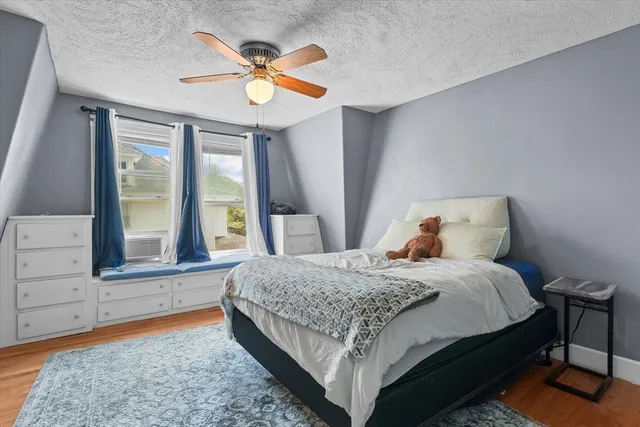 a bedroom with a bed and window