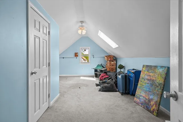 a view of a livingroom with furniture and a window