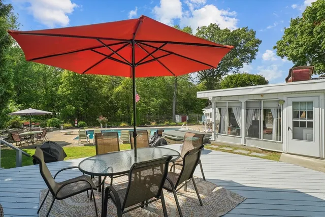 a view of a chair and table in the patio
