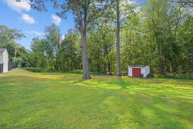 a backyard of a house with lots of green space