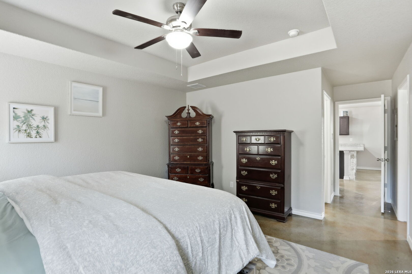 341 Ridge Road Spring Branch, TX 78070 - Photo 11 of 23 a bedroom with a large bed and a chandelier