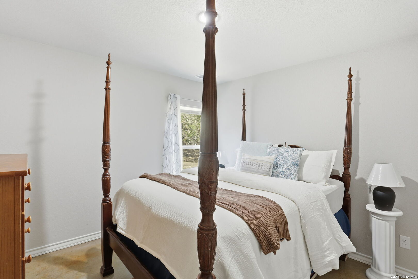 341 Ridge Road Spring Branch, TX 78070 - Photo 14 of 23 a bedroom with a bed and a night stand