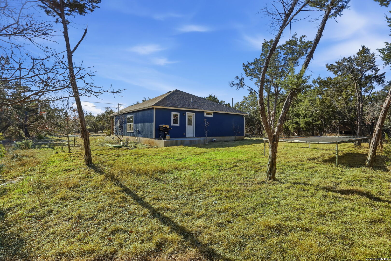 341 Ridge Road Spring Branch, TX 78070 - Photo 19 of 23 a view of a house with a yard