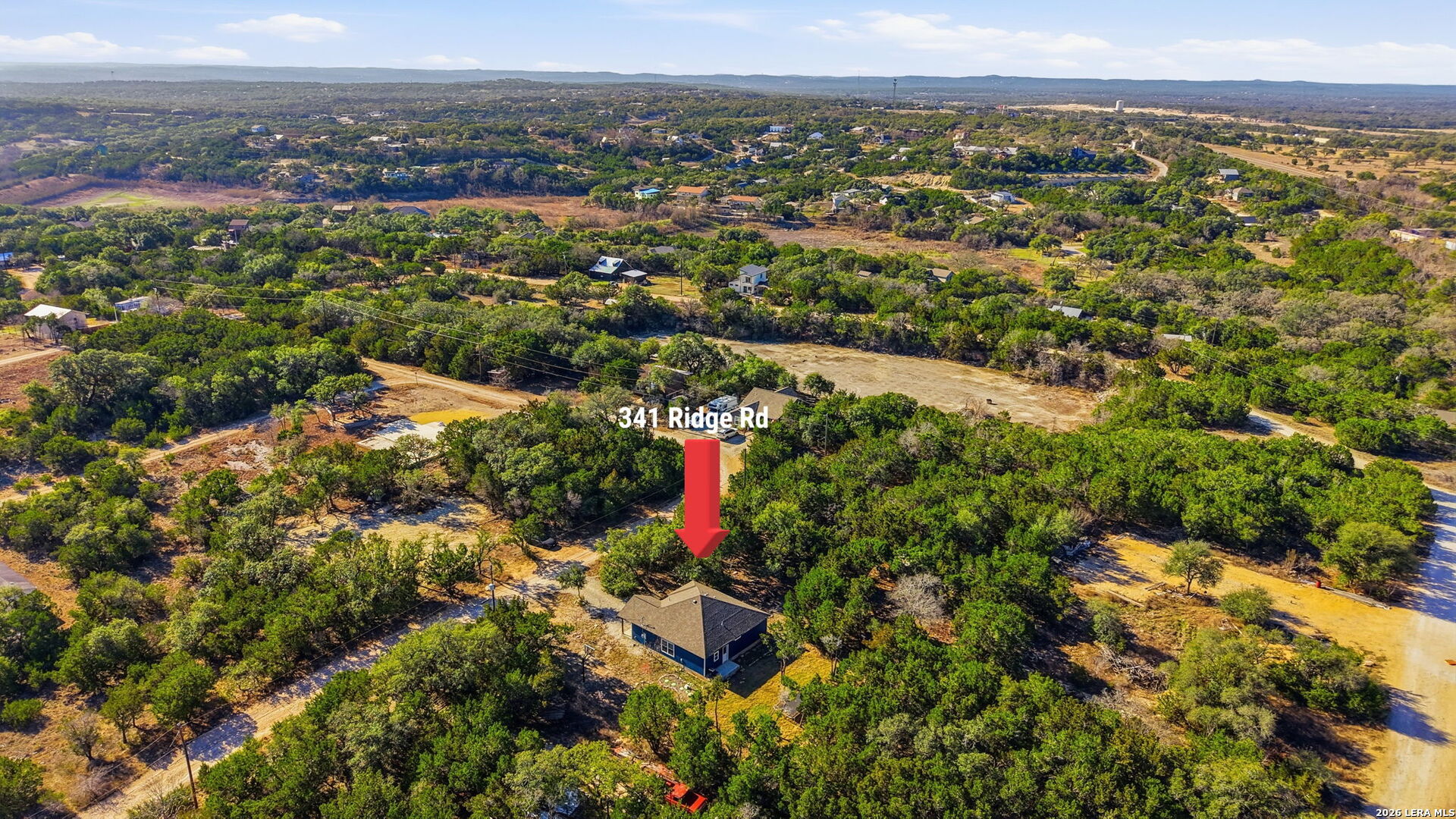 341 Ridge Road Spring Branch, TX 78070 - Photo 23 of 23 an aerial view of residential houses with outdoor space and trees