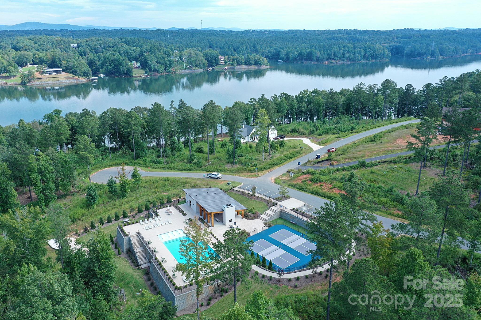 2576 Jumping Run Connelly Springs, NC 28612 - Photo 24 of 29 a view of a lake with a yard and mountain view