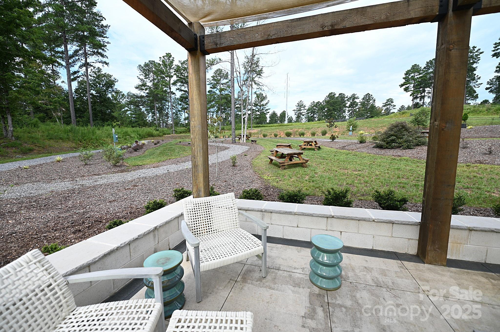 2576 Jumping Run Connelly Springs, NC 28612 - Photo 27 of 29 a view of a porch with furniture and garden