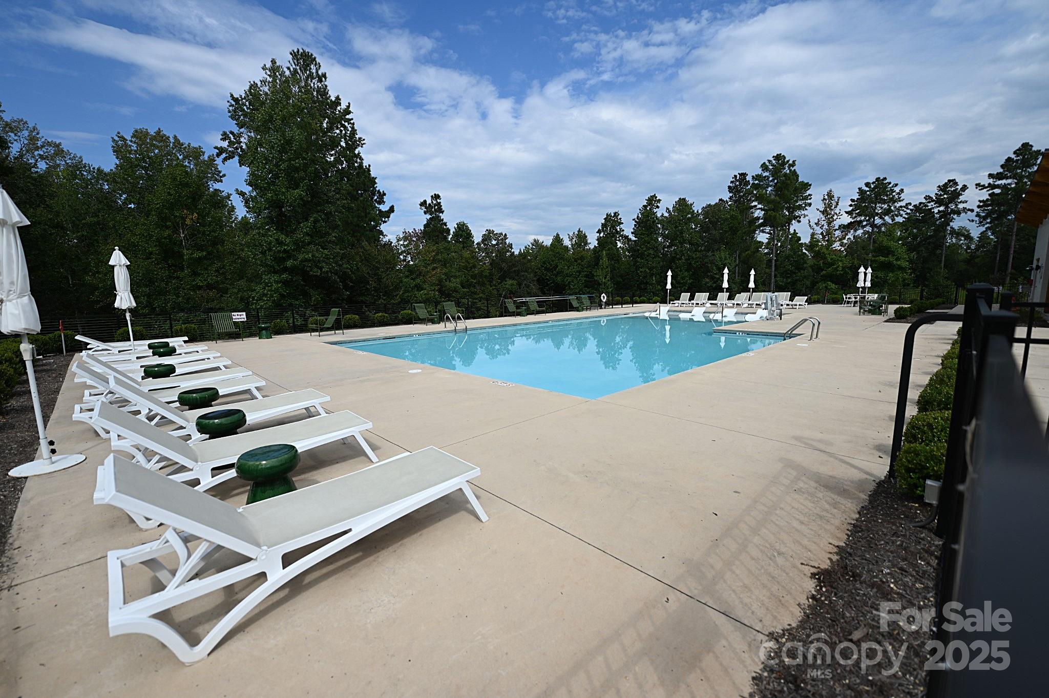2576 Jumping Run Connelly Springs, NC 28612 - Photo 29 of 29 a view of a swimming pool with a yard