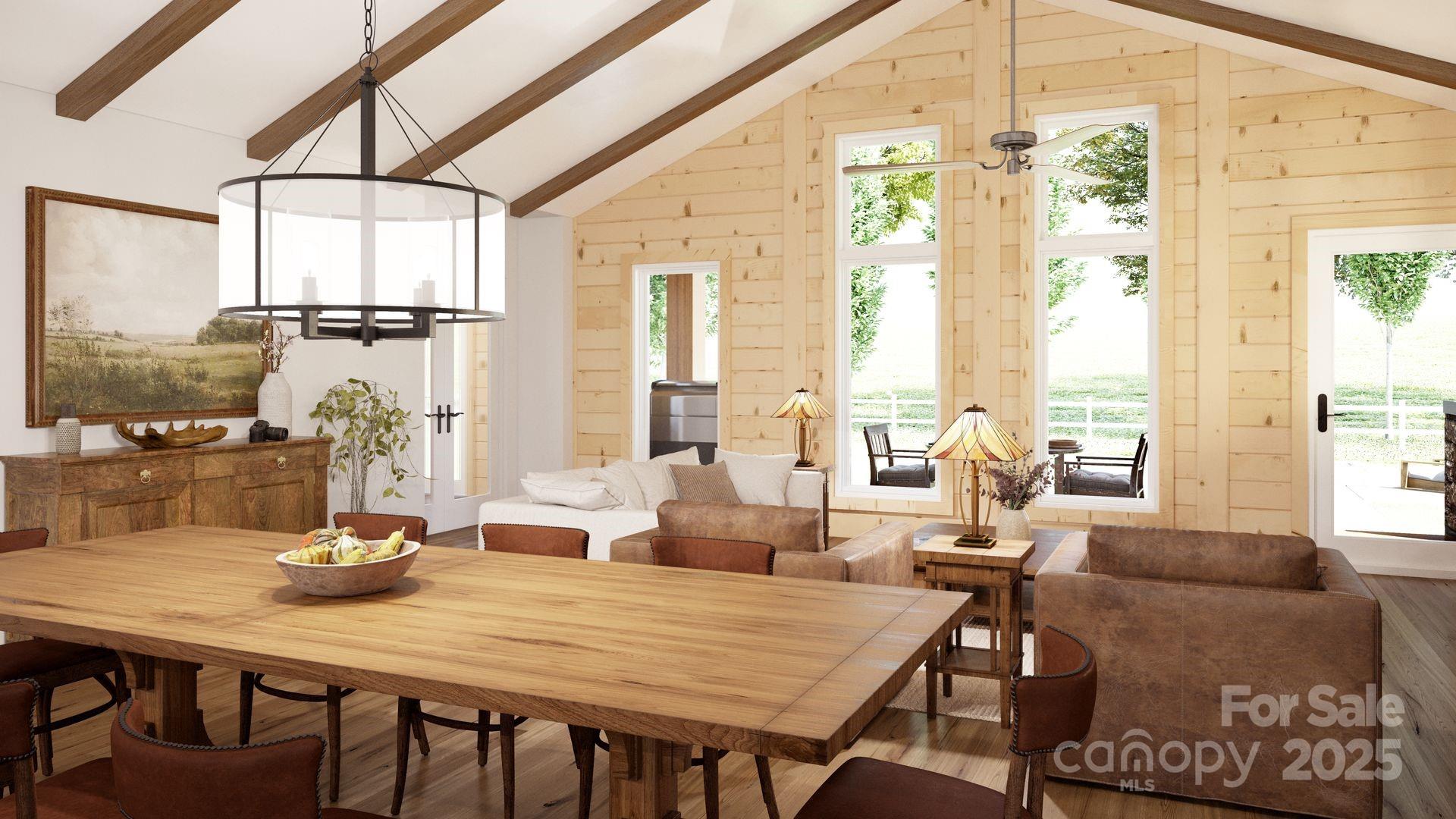 2576 Jumping Run Connelly Springs, NC 28612 - Photo 8 of 29 a living room with furniture a table and large windows