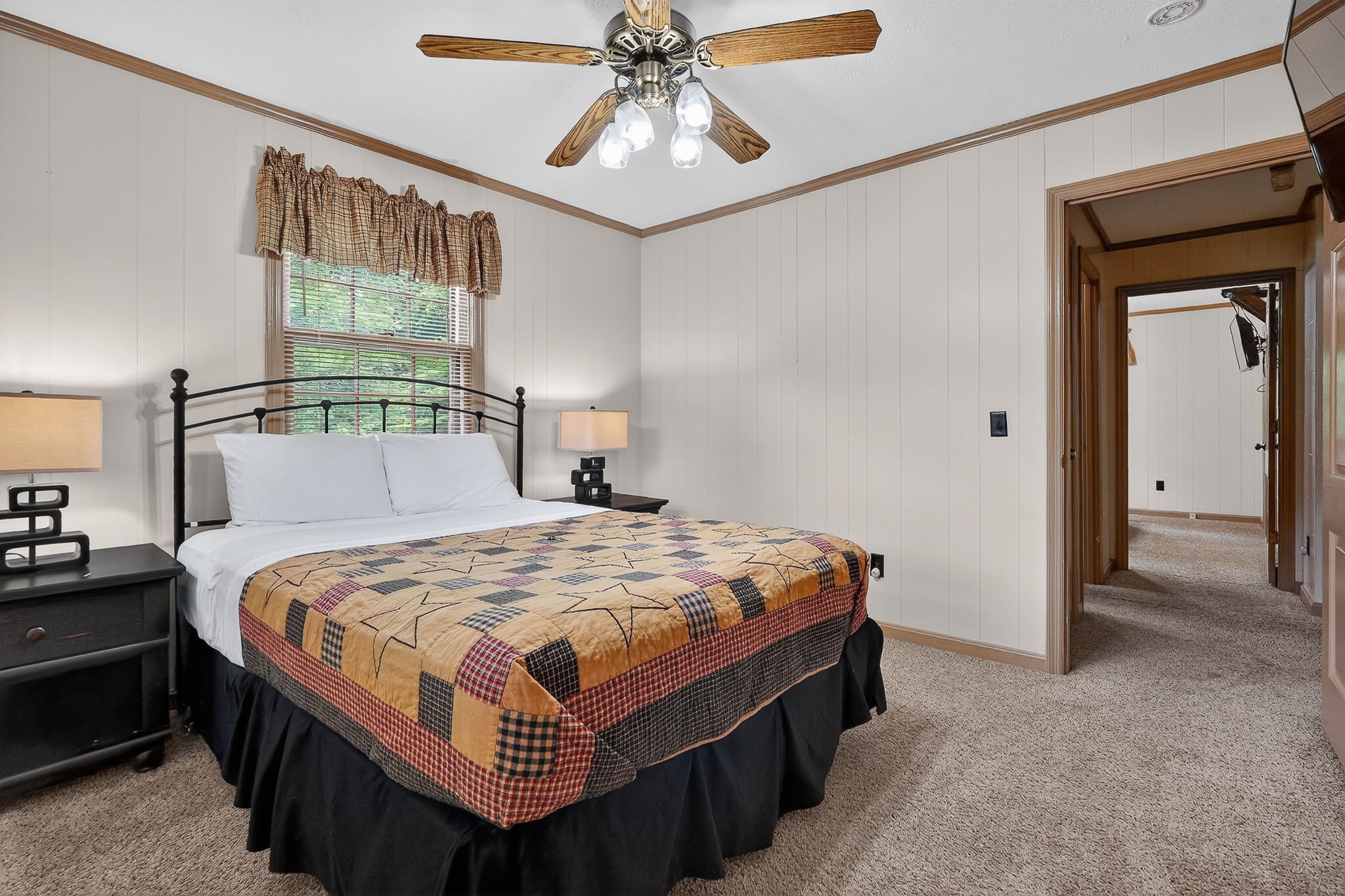 5642 Pates Ford Road Smithville, TN 37166 - Photo 14 of 32 a bedroom with a bed and a chandelier