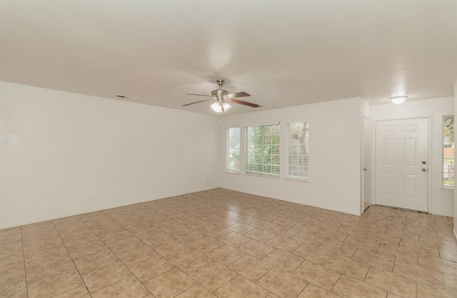 13551 7th Street Parlier, CA 93648 - Photo 2 of 17 a view of an empty room with a window