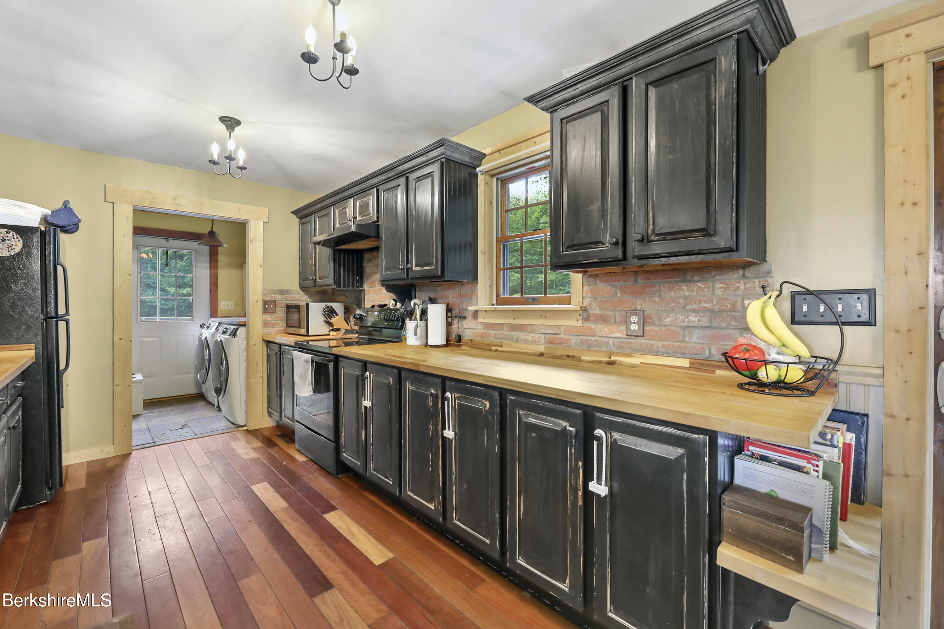 31 Moores Road Florida, MA 01247 - Photo 29 of 44 a kitchen with sink cabinets and wooden floor