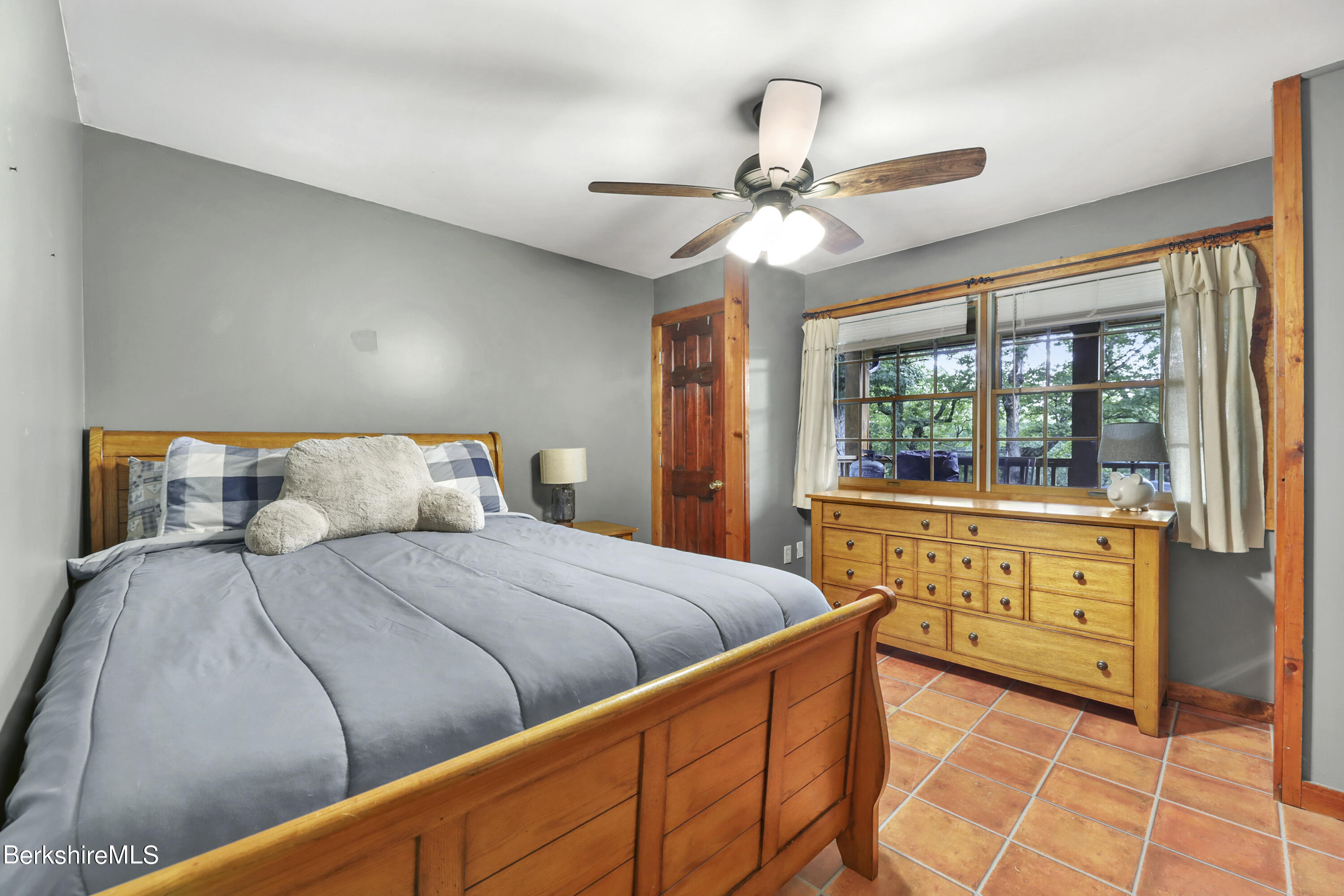 31 Moores Road Florida, MA 01247 - Photo 34 of 44 a bedroom with a large bed and a chandelier