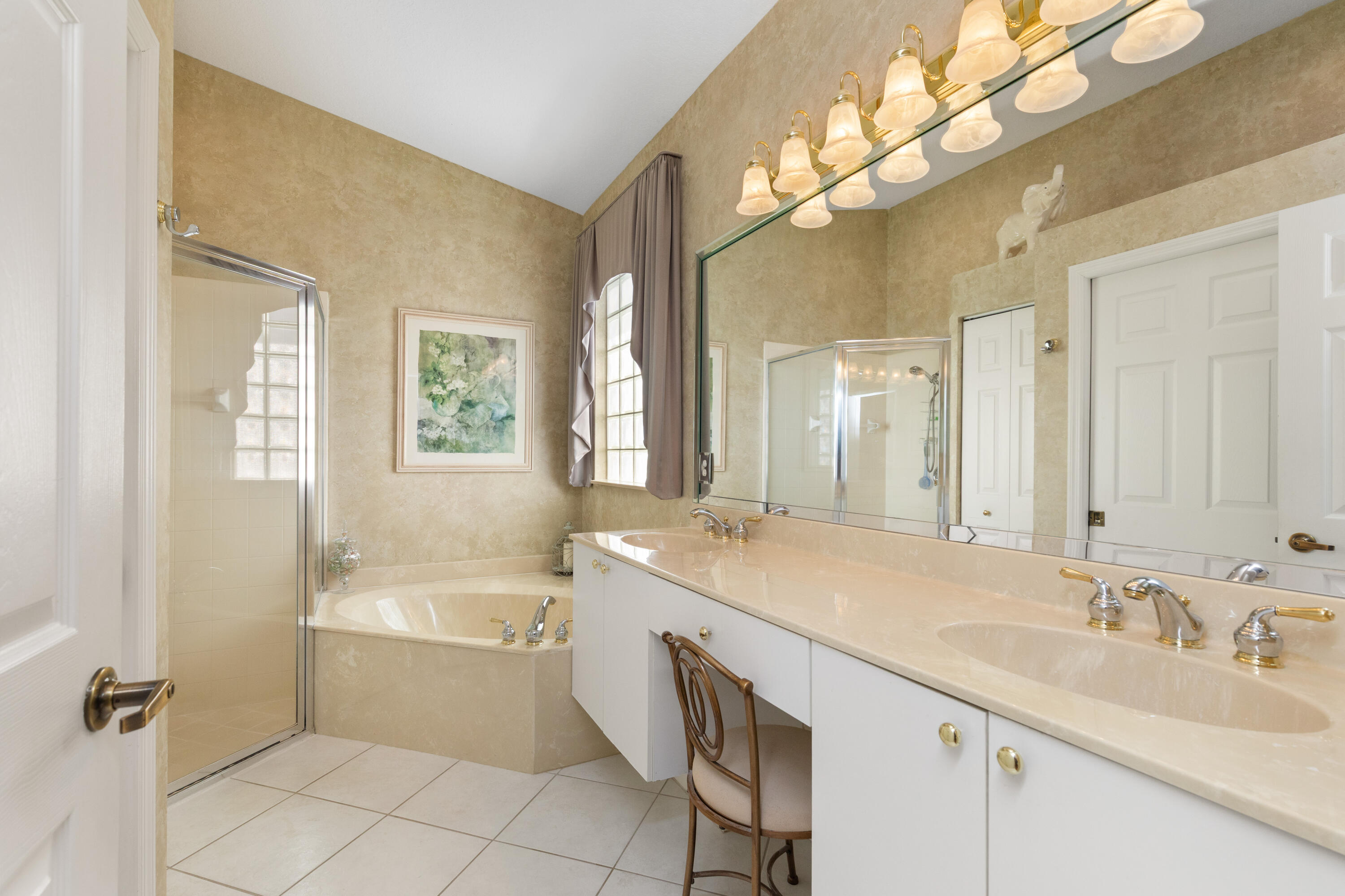6698 Vía Roma Delray Beach, FL 33446 - Photo 14 of 50 a bathroom with a granite countertop sink mirror and bathtub