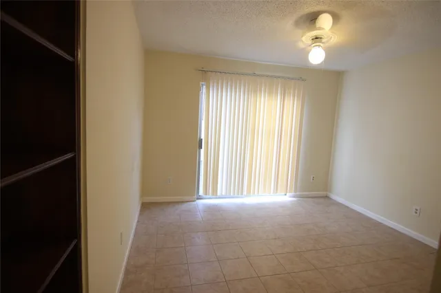 a view of empty room with windows