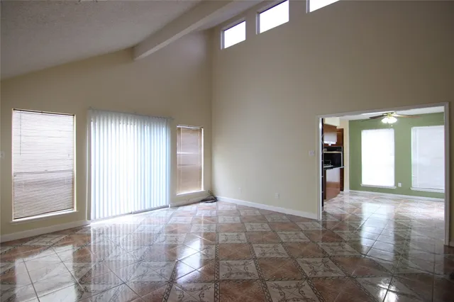 a view of an empty room and window