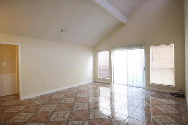 a view of an empty room and window