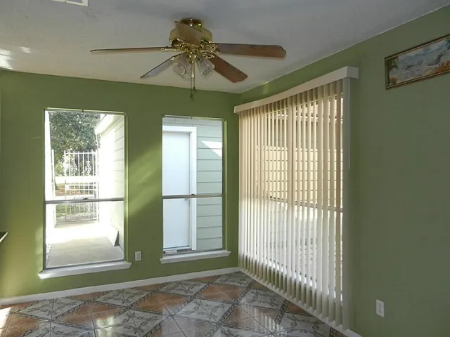 a view of an empty room with a window