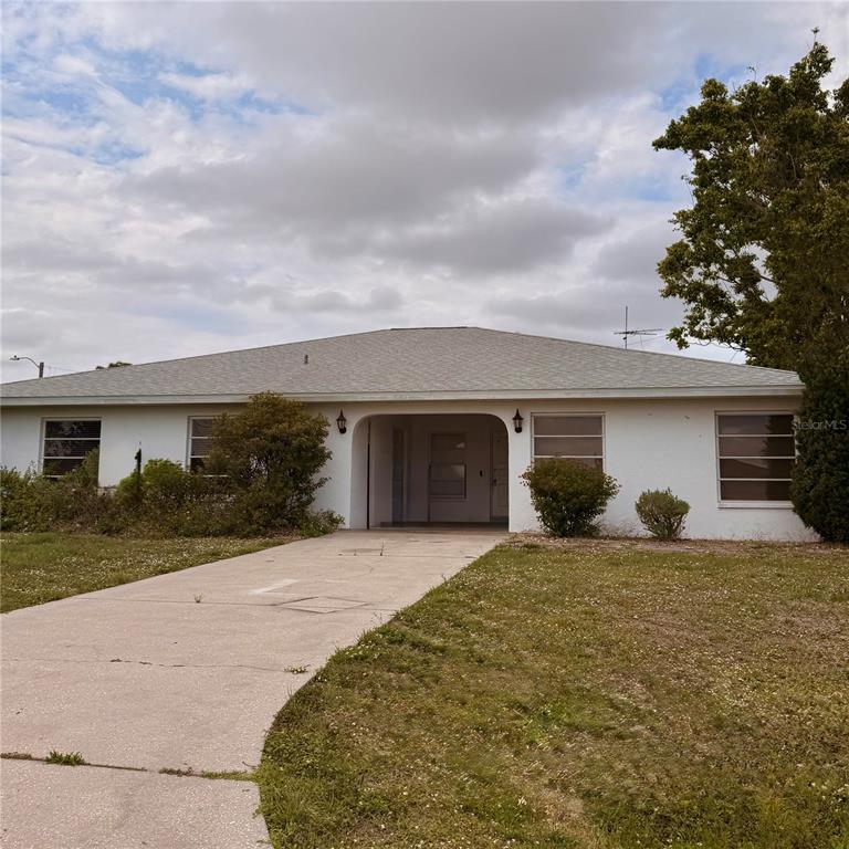 201 San Marco Avenue, Unit 1 North Port, FL 34287 - Photo 1 of 13 front view of a house with a yard