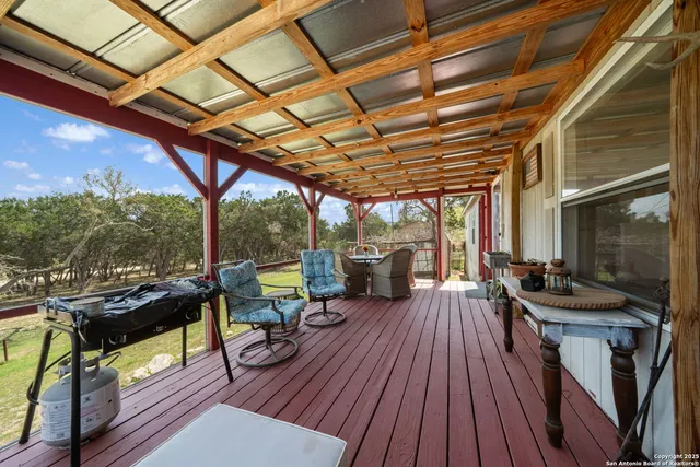 a view of a chairs and table on the balcony